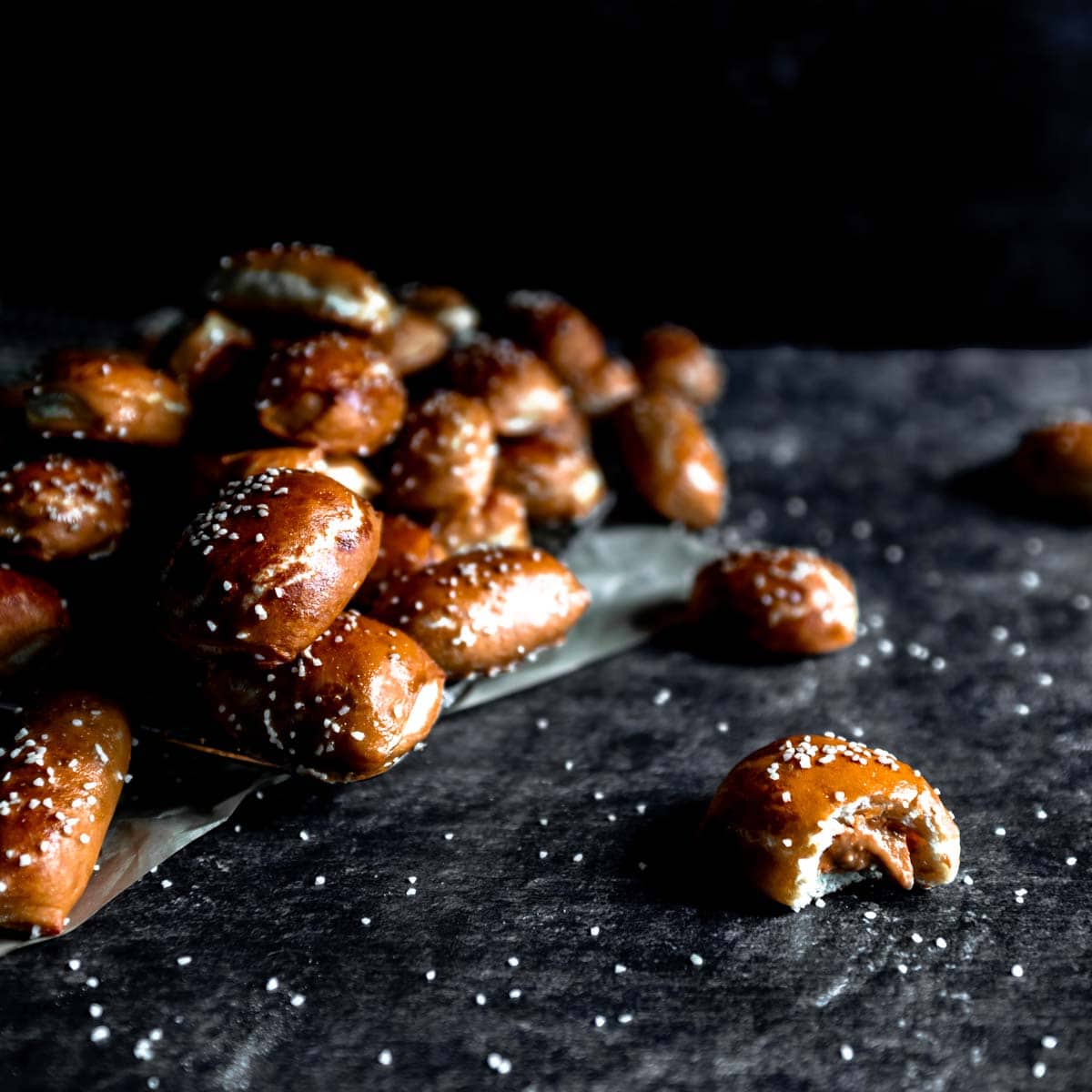 peanut butter filled pretzel nugget with a bite taken out