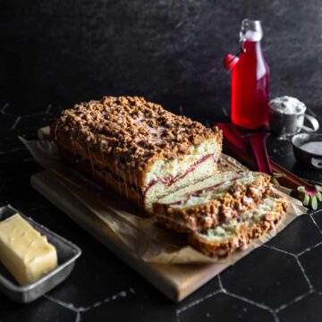 slices cut off a loaf of sour cream rhubarb crumble bread