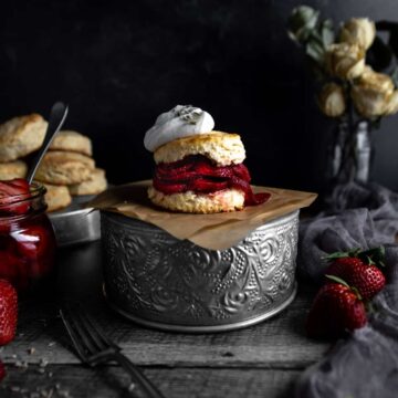 A Lavender Strawberry Shortcake on a tin stand