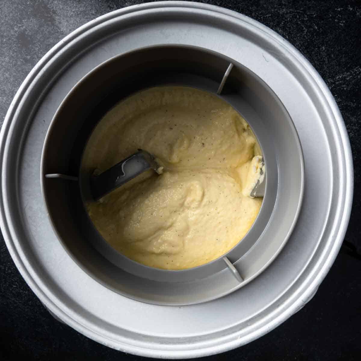 Freshly churned vanilla bean Ince cream in the ice cream maker.