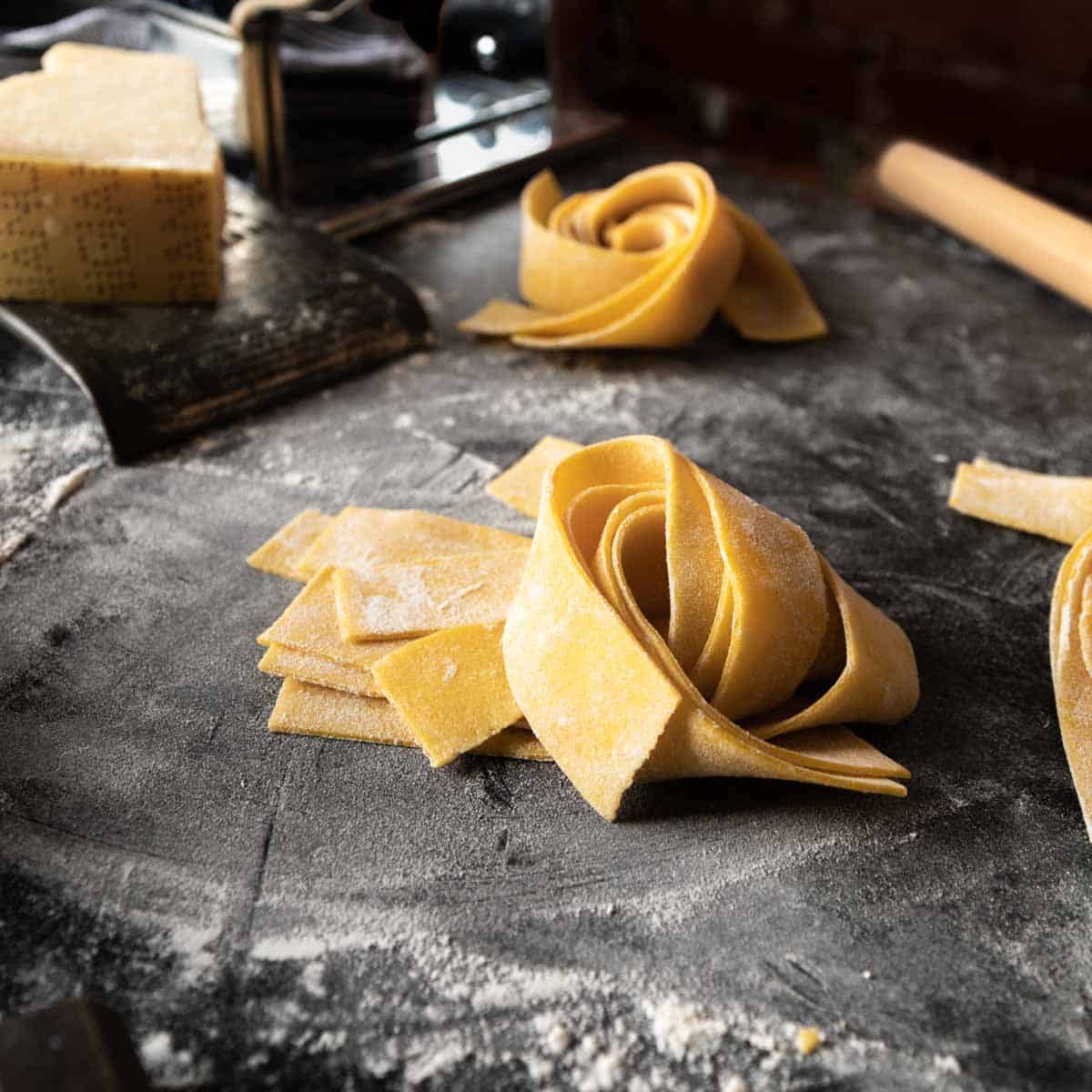 Making pappardelle pasta, cutting pasta dough into strips