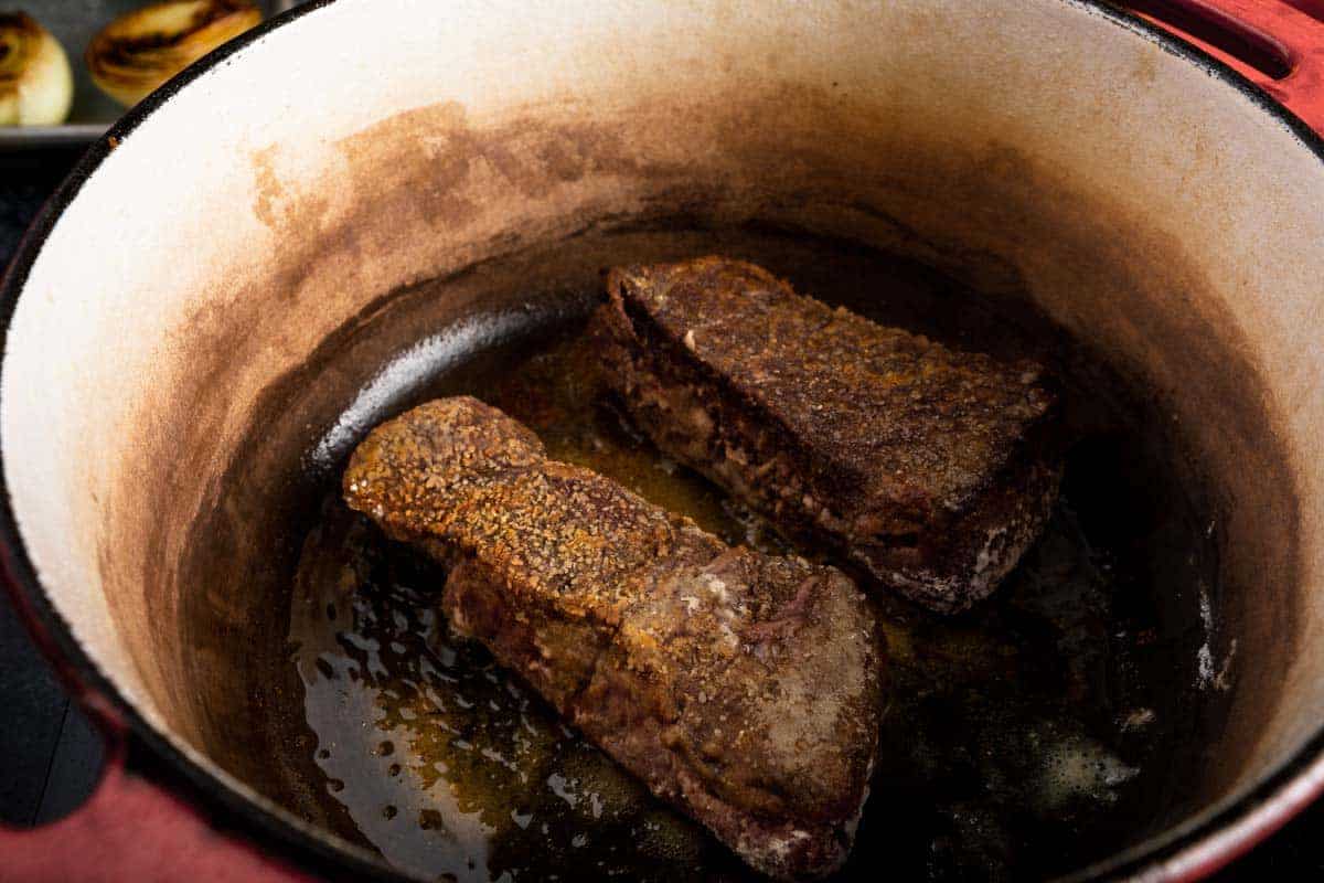 crisp seared boneless beef short ribs in a dutch oven