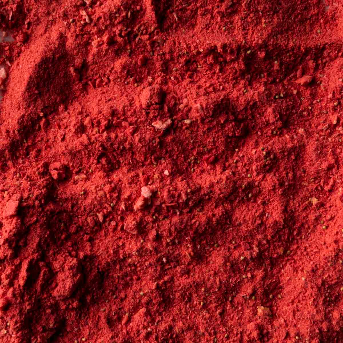 A macro shot of freeze dried strawberry powder.