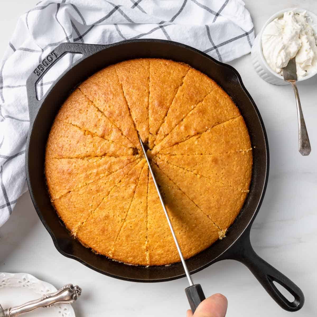 Slicing the sweet skillet cornbread into wedges