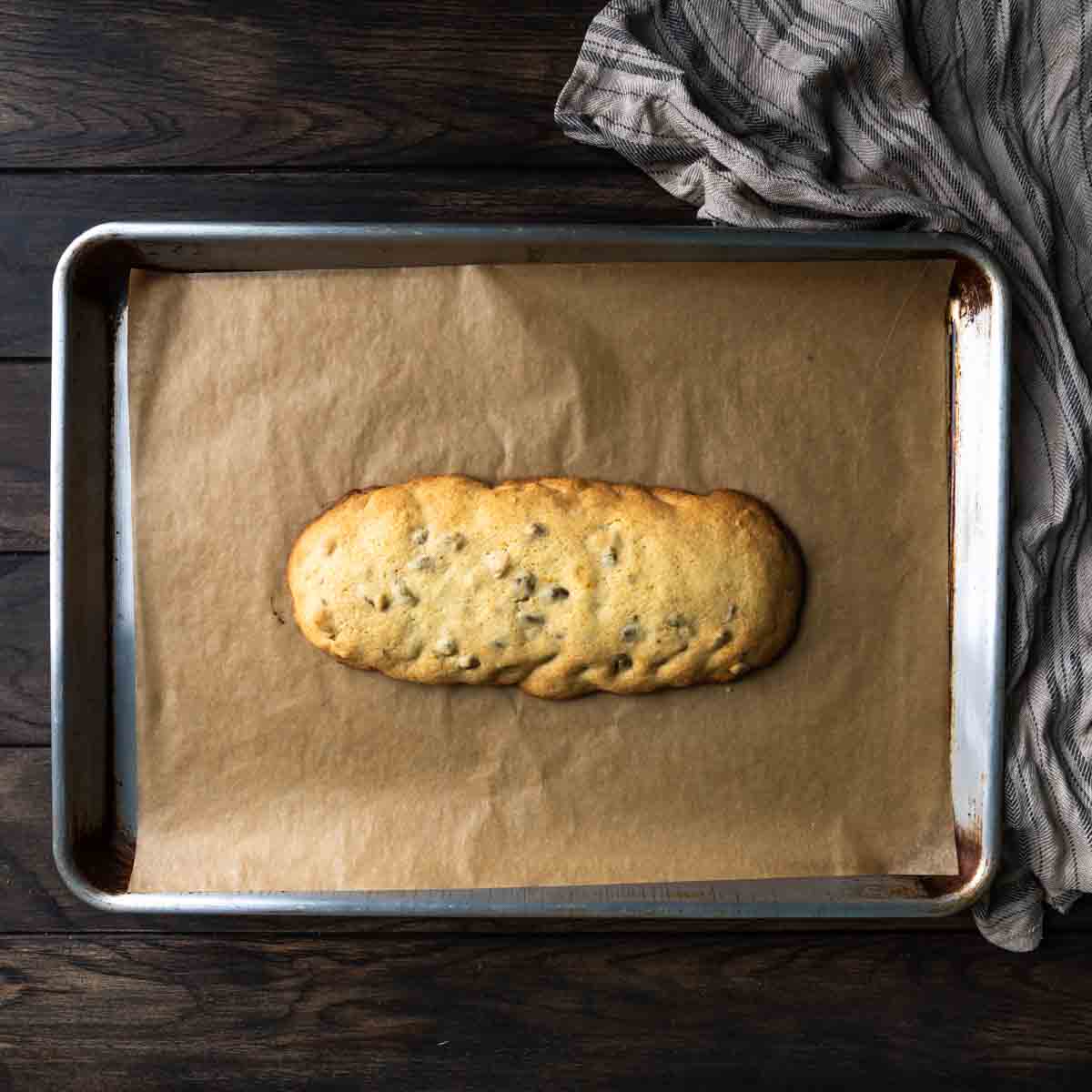 The lightly golden baked log of biscotti