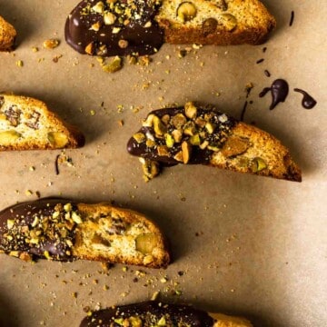 A tray with chocolate dipped pistachio biscotti
