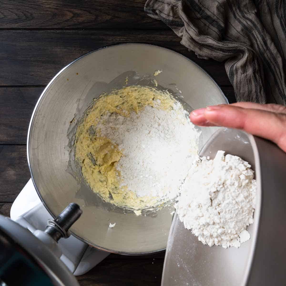 Adding dry ingredients to the stand mixer