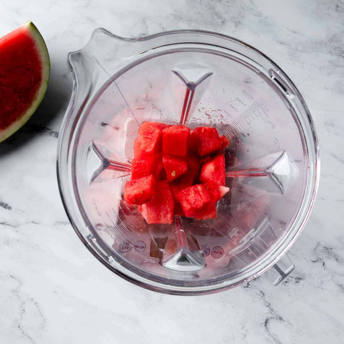 Chunks of watermelon in a blender