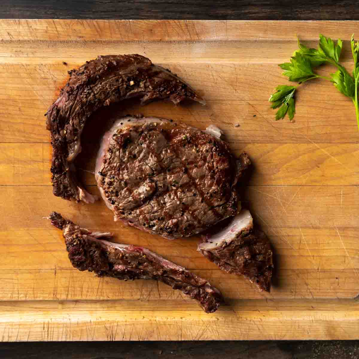 A grilled ribeye steak cut into muscular sections