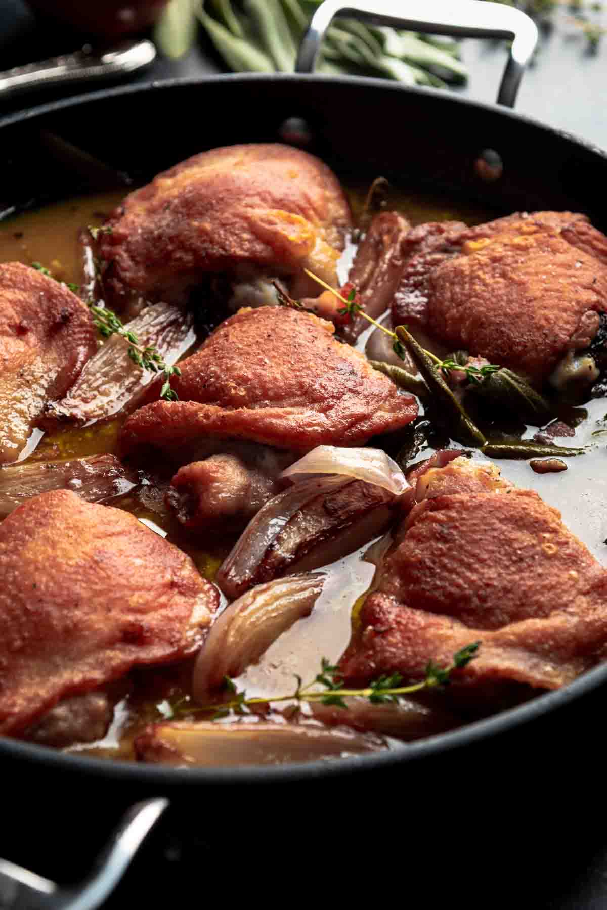 Crispy chicken thighs braised in a cider pan sauce with shallot and bacon.