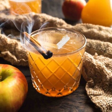 An apple cider whiskey sour with smoked cinnamon