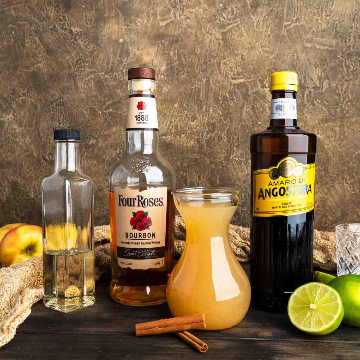 Ingredients needed to make an apple cider bourbon cocktail