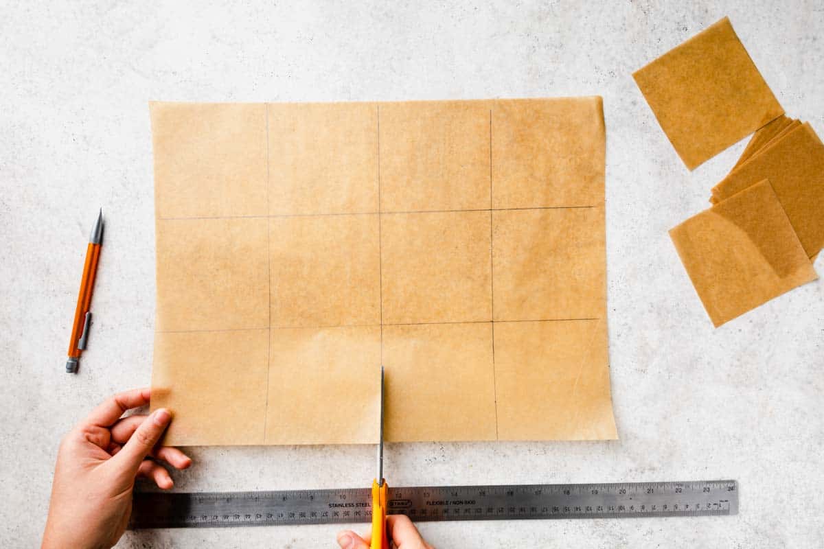 Measuring and cutting parchment paper into squares