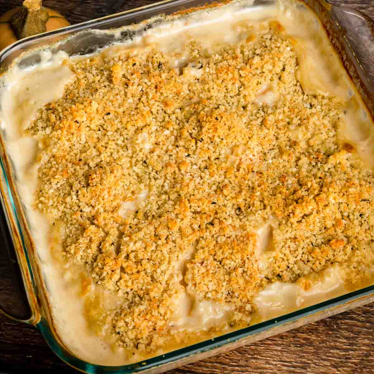 Butternut squash au gratin in a casserole dish covered with toasted breadcrumbs