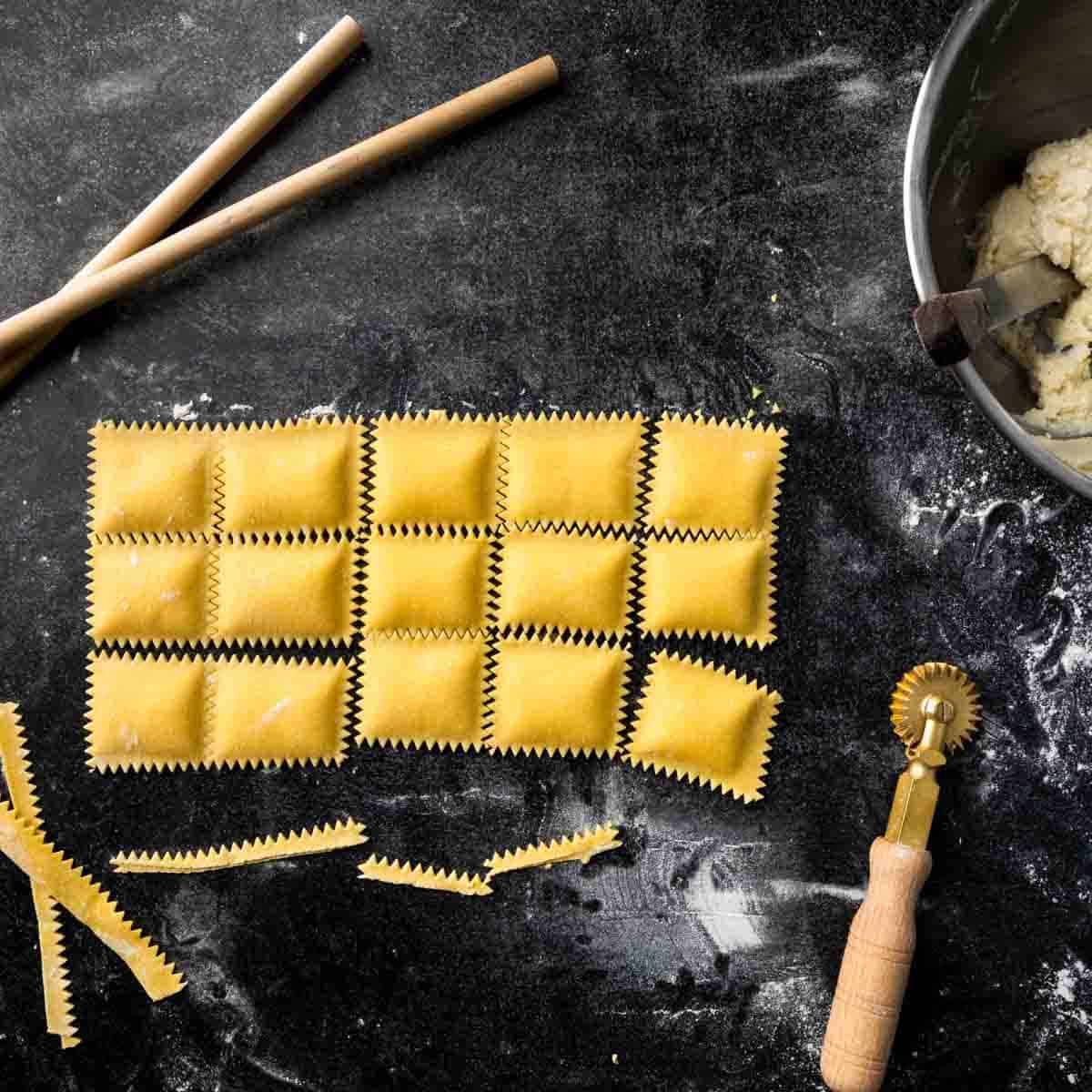 A sheet of ravioli made with dowels and a fluted pasta wheel. 