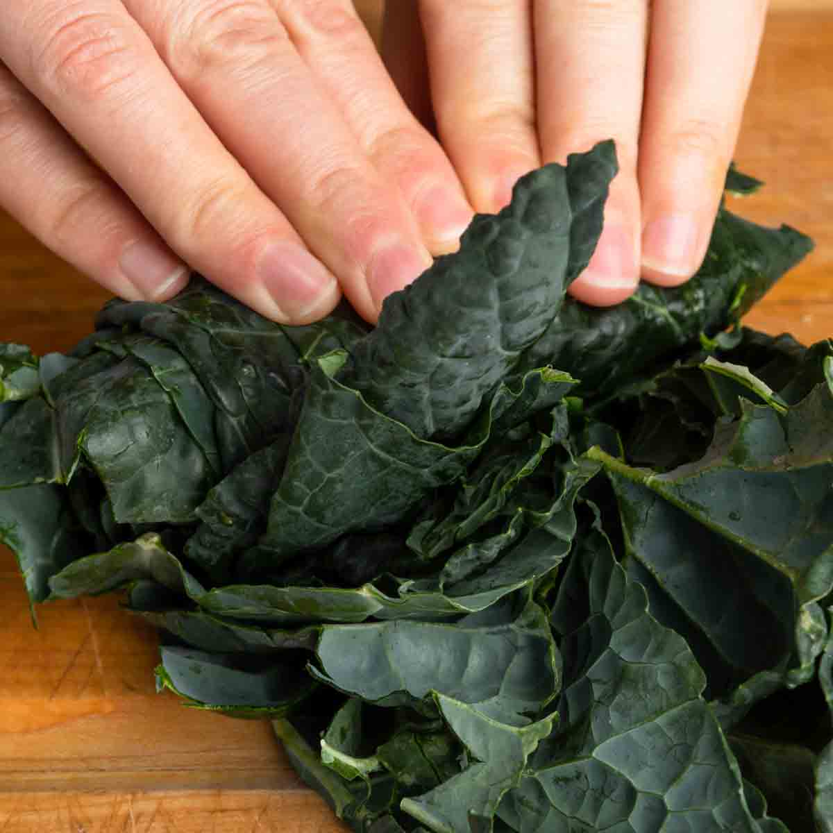 Rolling kale leaves up to chiffonade them.