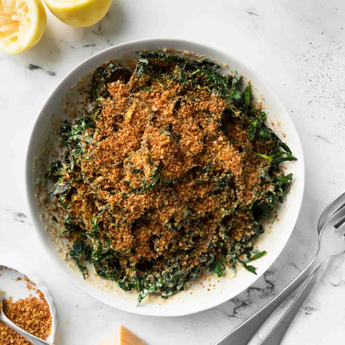 An overhead image of Tuscan kale salad with lemons and toasted breadcrumbs.