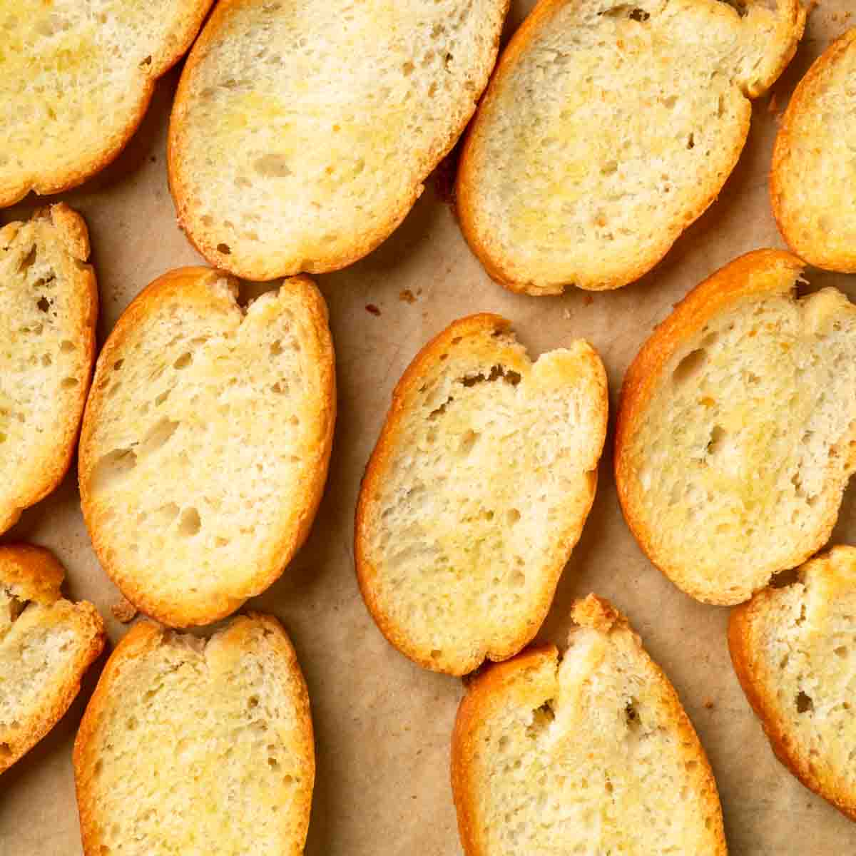 Perfectly toasted crostini slices with golden brown edges.