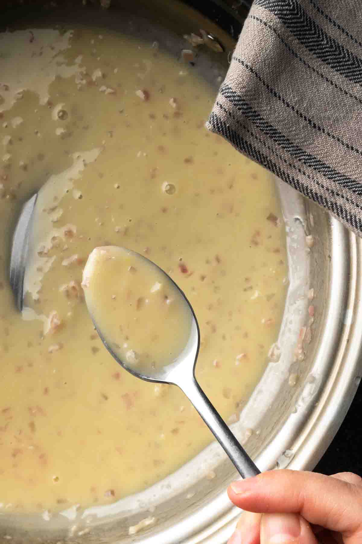 A spoonful of glossy white wine lemon butter sauce.