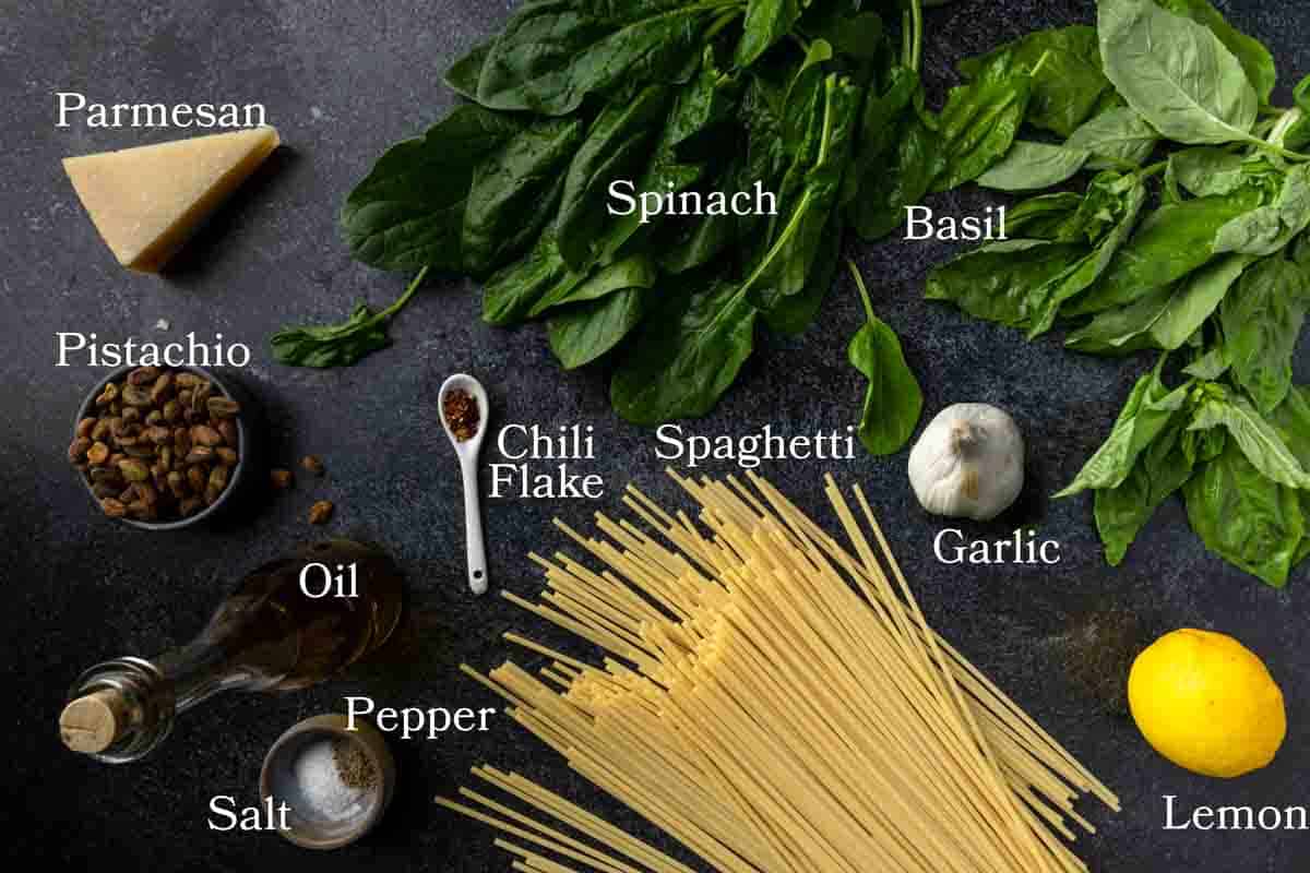 Ingredients for spaghetti pasta with homemade spinach and pistachio pesto sauce.