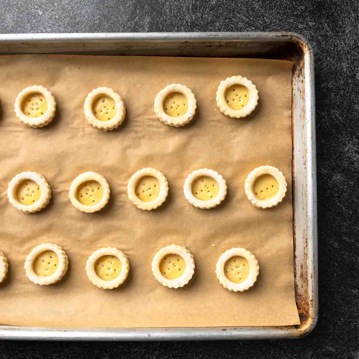 A sheet pan with rows of docked mini vol-au-vent.