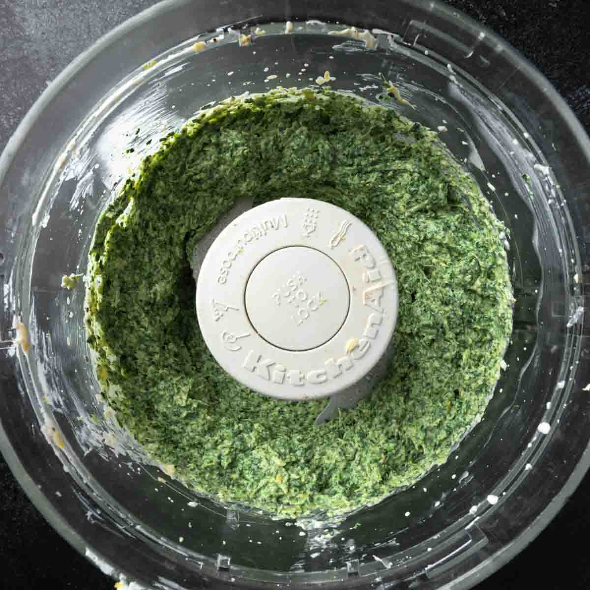 Spinach and artichoke cream cheese dip in a food processor. 