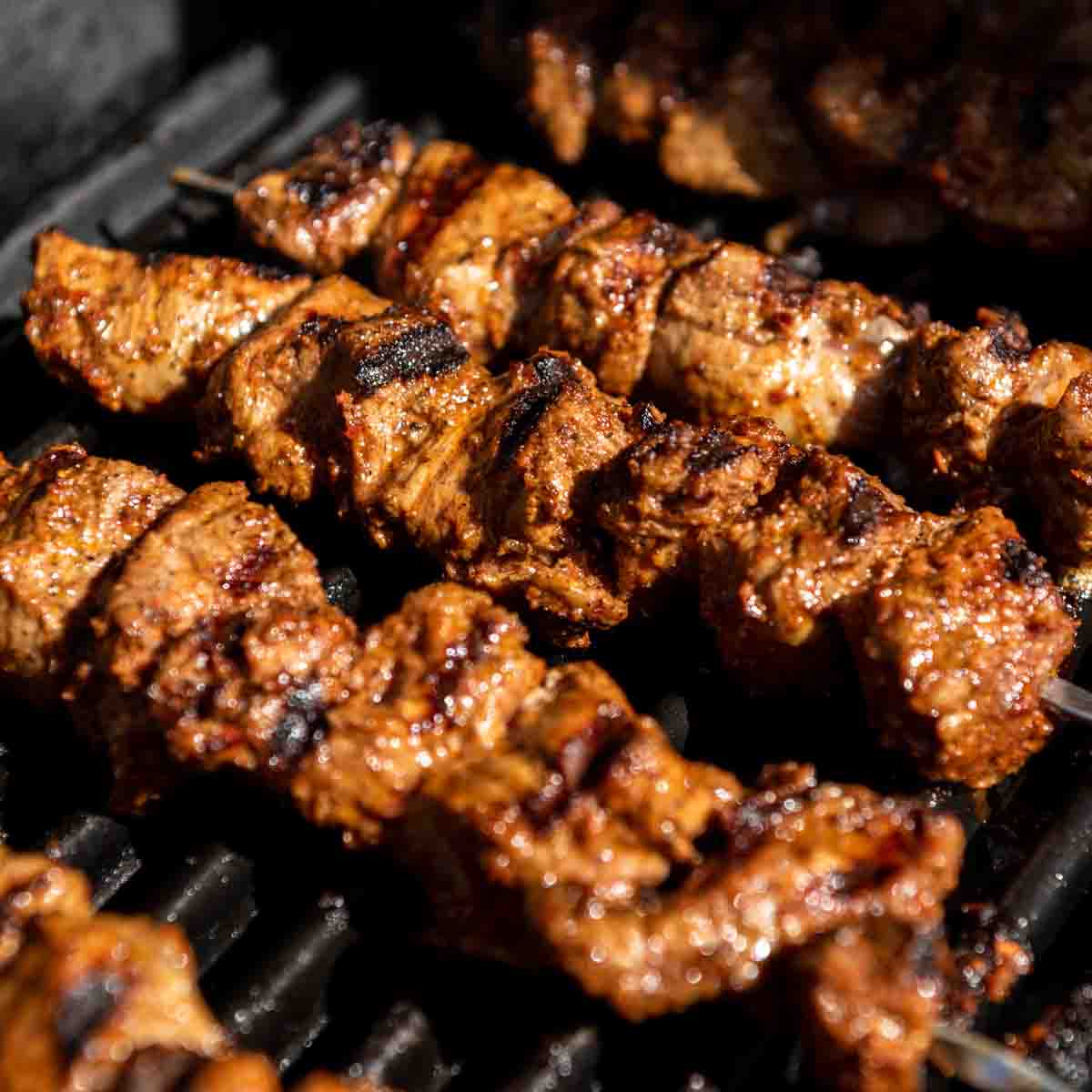 Lamb shish kebabs being cooked on the grill. 