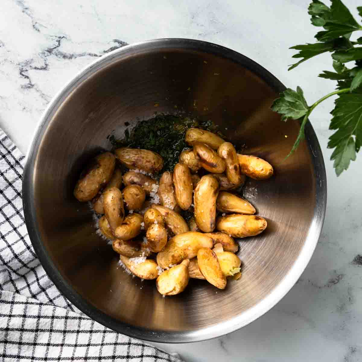 Grilled potatoes seasoned with lemon and parsley.