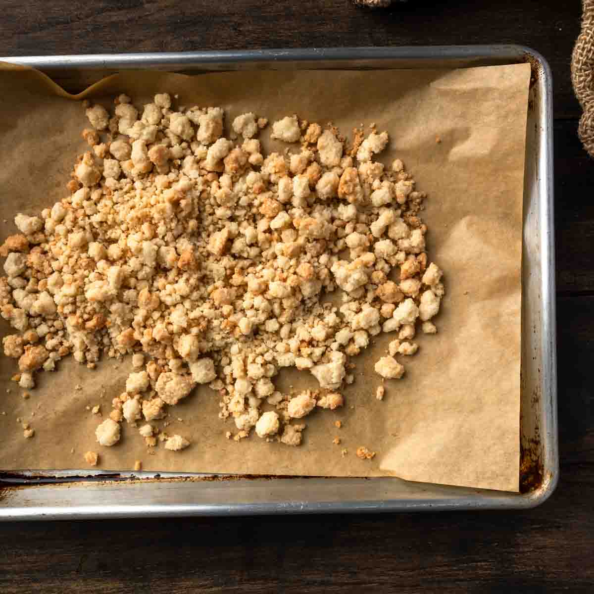 Golden cobbler crumb topping on a baking tray. 