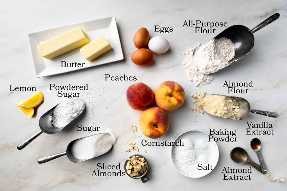 Ingredients needed to make peach frangipane crostata from scratch. 
