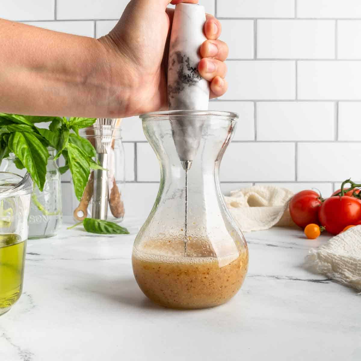 Using a mini electric whisk (milk frother) to combine the vinegar and seasonings.