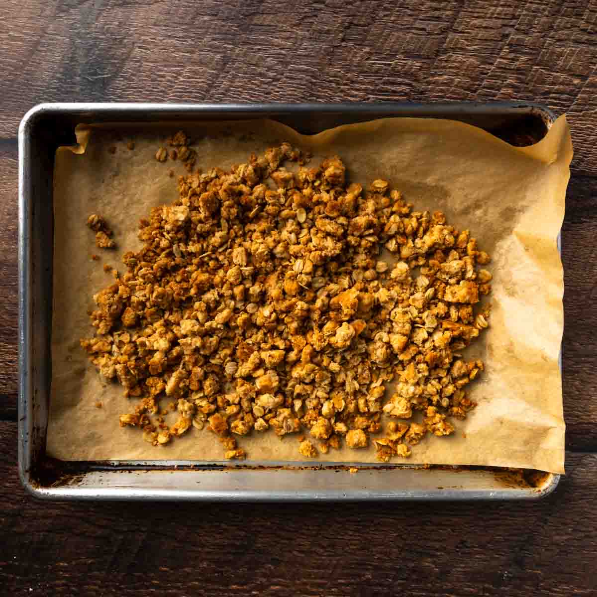 Golden baked oat crumble on a baking tray. 