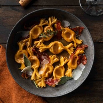 Sweet potato caramelle pasta in a brown butter balsamic sauce with prosciutto.