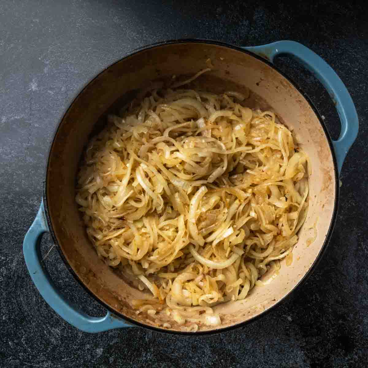 Lightly browned onions in a bid Dutch oven.