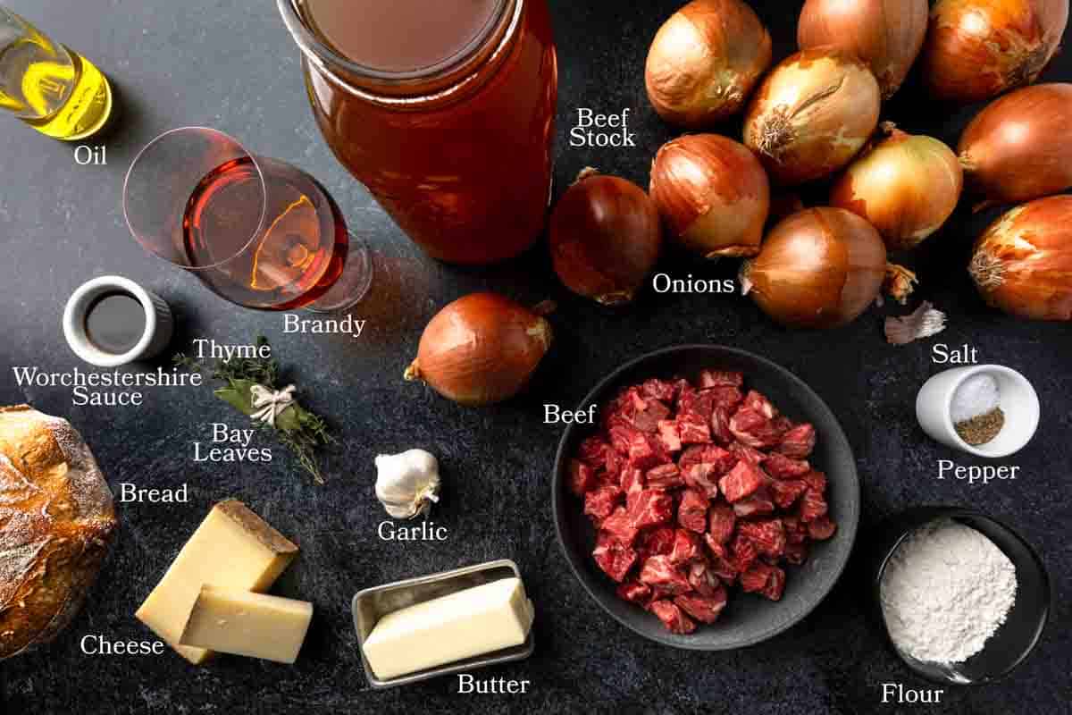 Ingredients needed to make a French onion beef stew with a melty cheese and crouton topping.